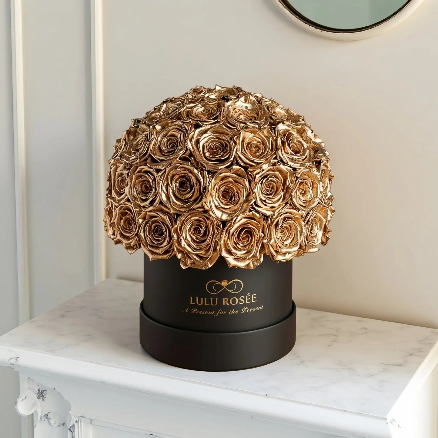 LULU ROSÉE superdome box gold roses black box on a marble surface