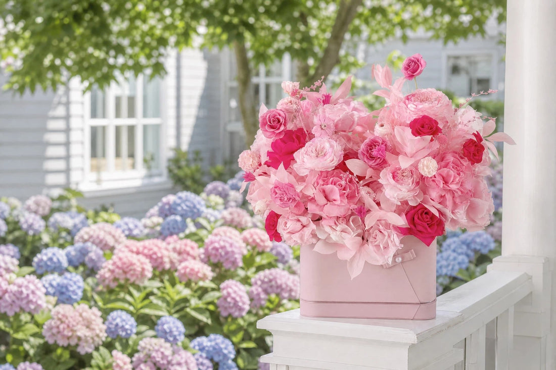 LULU ROSÉE Parisian Bloom Garden pink preserved rose flower box on white cottage porch, romantic summer floral arrangement with pastel pink and blue hydrangea garden backdrop, luxury everlasting flower home decor for summer wedding and baby shower gifting