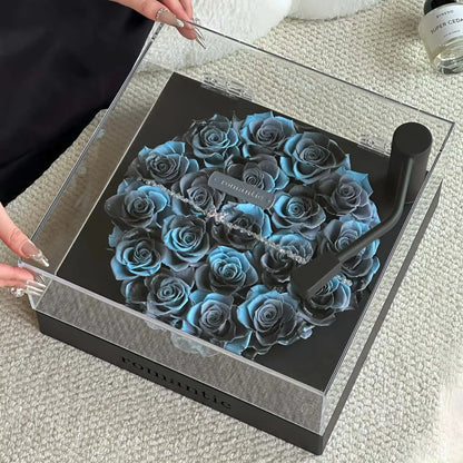 LULU ROSÉE Close-Up of Aqua Blue Rose Turntable, Light Blue Preserved Rose Arrangement