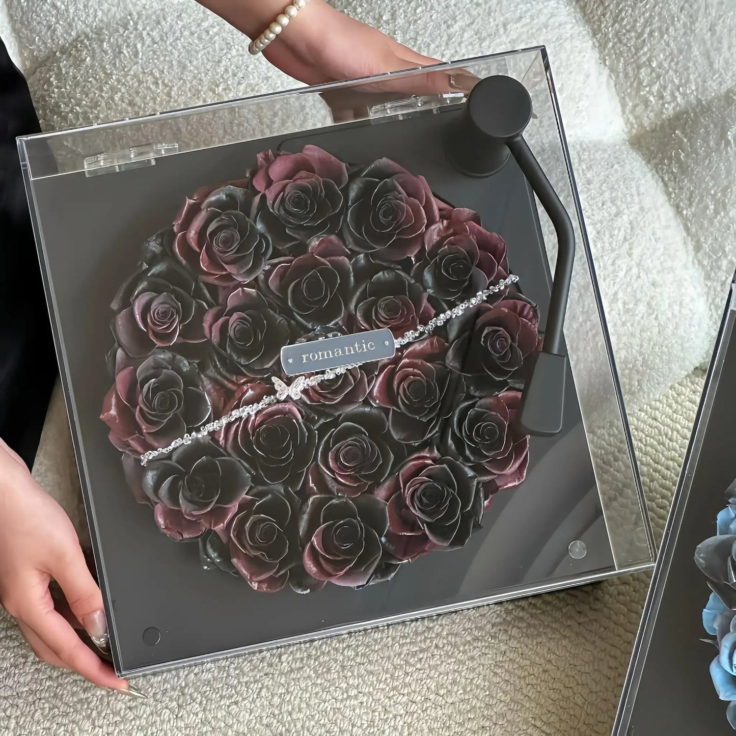 LULU ROSÉE Close-Up of Vintage Noir Rose Turntable, Dark Purple Preserved Rose Arrangement
