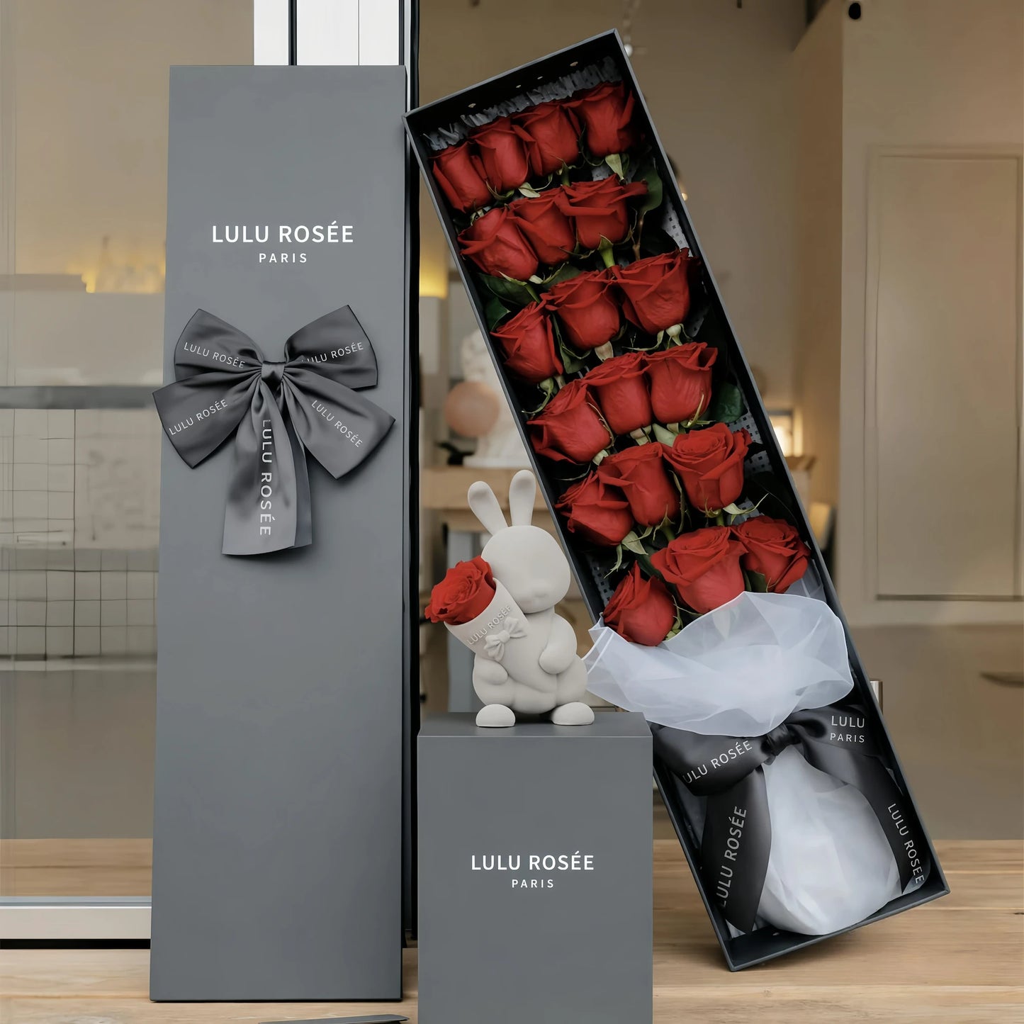 LULU ROSÉE Grande Long Stem Preserved Rose Box, luxury long rectangular gift box filled with long stem red preserved roses, home interior styling with bunny decor, decorated with elegant grey satin ribbon, customizable flower colors, everlasting romantic floral souvenir for Valentine’s Day, anniversary & birthday gifting