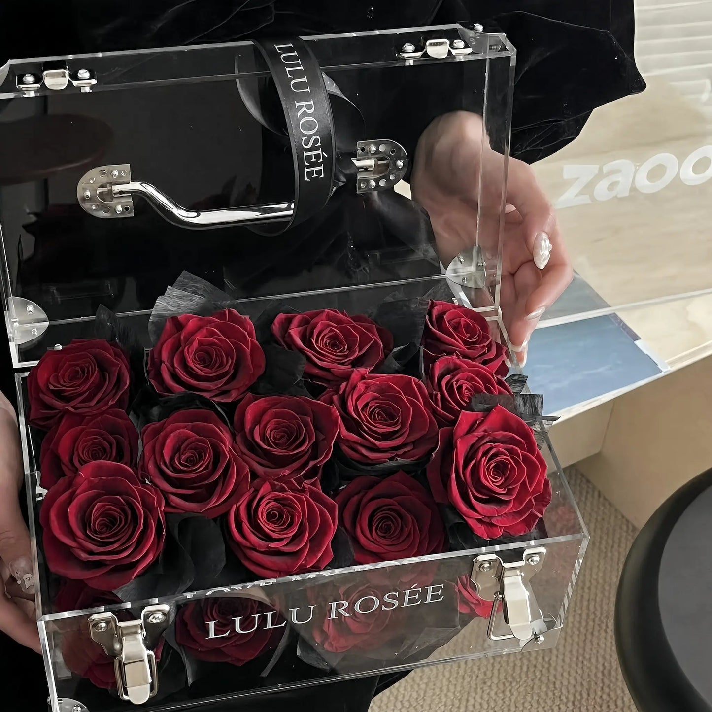 LULU ROSÉE Petite Eternal Acrylic Handbag Rose Box, small transparent acrylic handbag-shaped gift box filled with wine red preserved roses open lid front view, customizable flower color options, mini luxury everlasting floral souvenir for birthday, anniversary & romantic gift giving