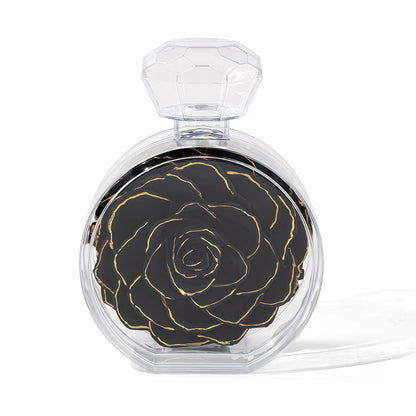 LULU ROSÉE single rose perfume bottle gold trimmed black rose on white background