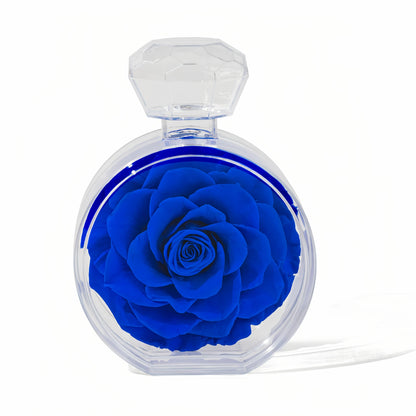 LULU ROSÉE single rose perfume bottle royal blue rose on white background